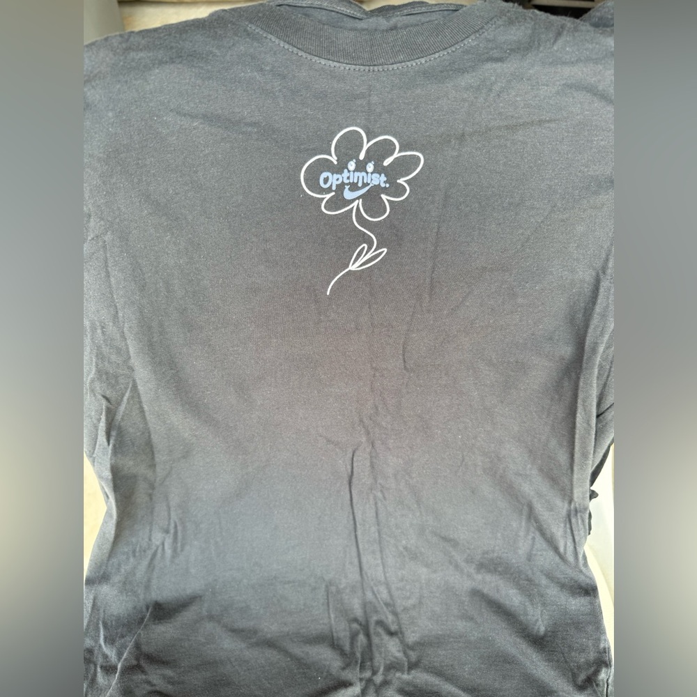 Nike “optimist” graphic tee.